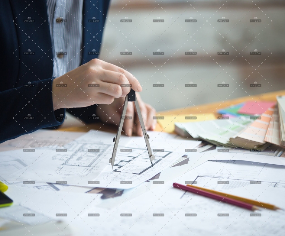 female-architect-using-drawing-compass-PZNMCEU-min.jpg